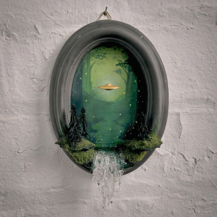 Diorama featuring UFO in a mystical forest scene with a waterfall, perfect for alien enthusiasts.