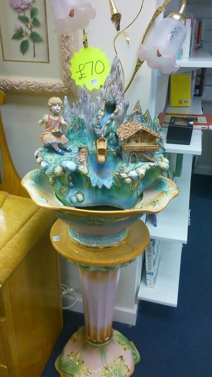 Bizarre treasure found in a secondhand shop: sculpted lamp with a mountain scene, priced at £70.