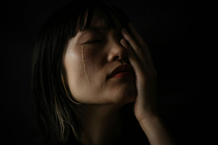 A person looking distressed, possibly overwhelmed by unconventional job hunting challenges.