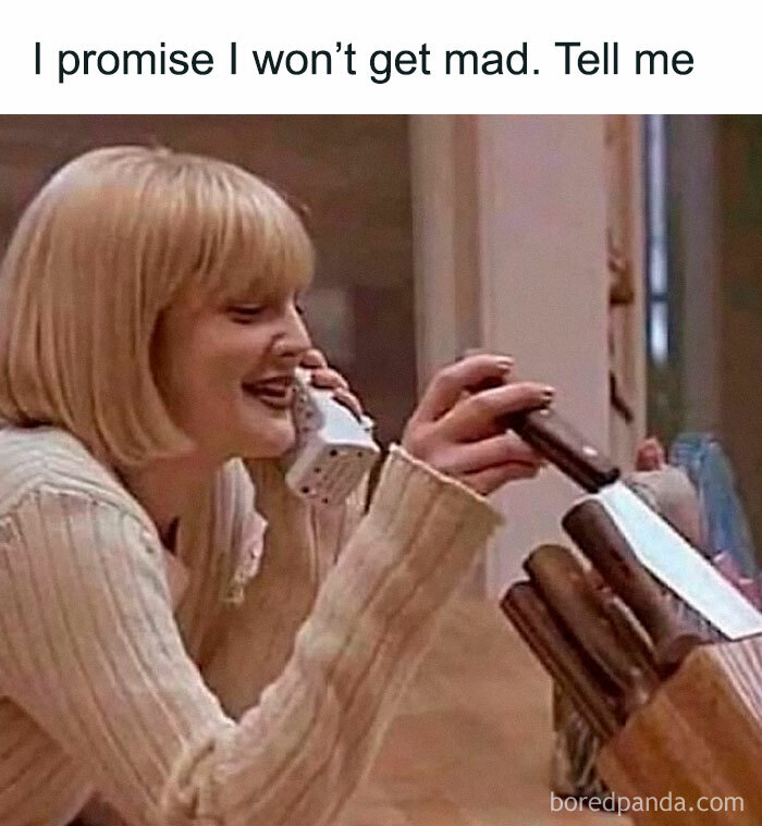 Woman on phone smiling while reaching for a knife, illustrating a funny meme and epitome of random humor.