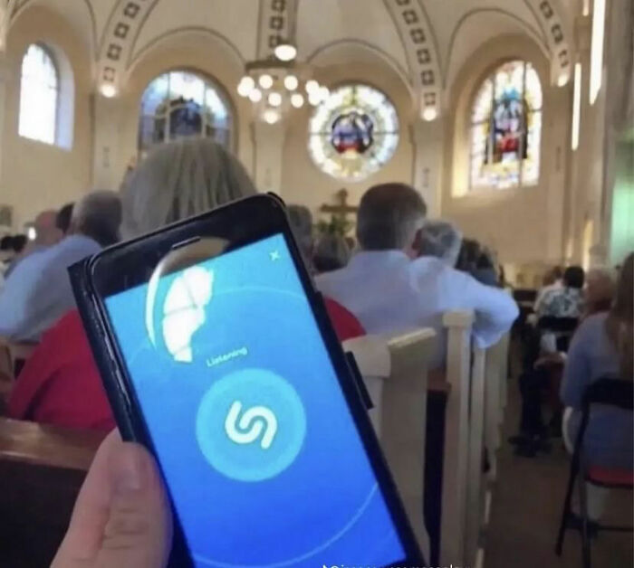 Phone using music app in a church setting, capturing humorous posts.