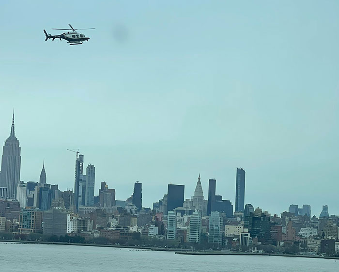 Helicopter over NYC skyline, linked to pilot's unexpected radio message before fatal crash.