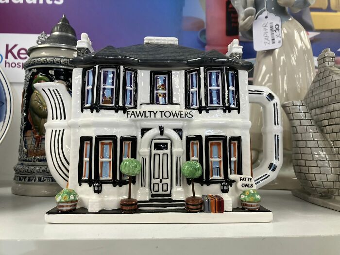 Fawlty Towers teapot, a bizarre treasure found in a secondhand shop, shaped like a classic building.