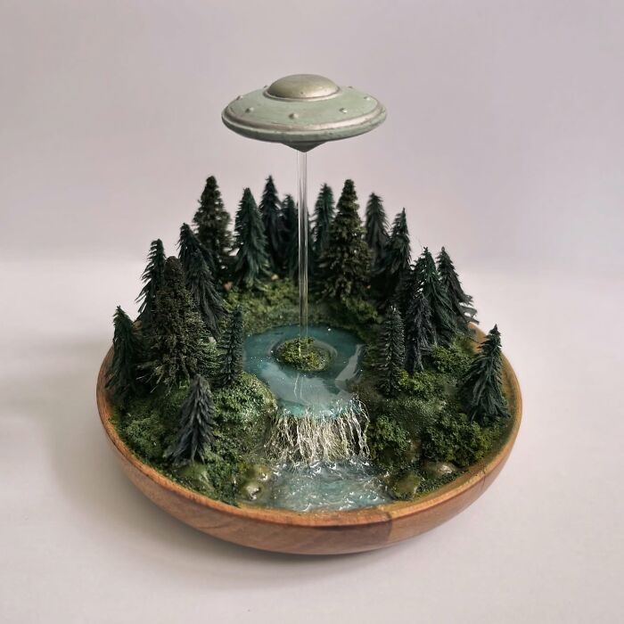 UFO-themed diorama with a flying saucer over a forest, perfect for alien and mystery aficionados.