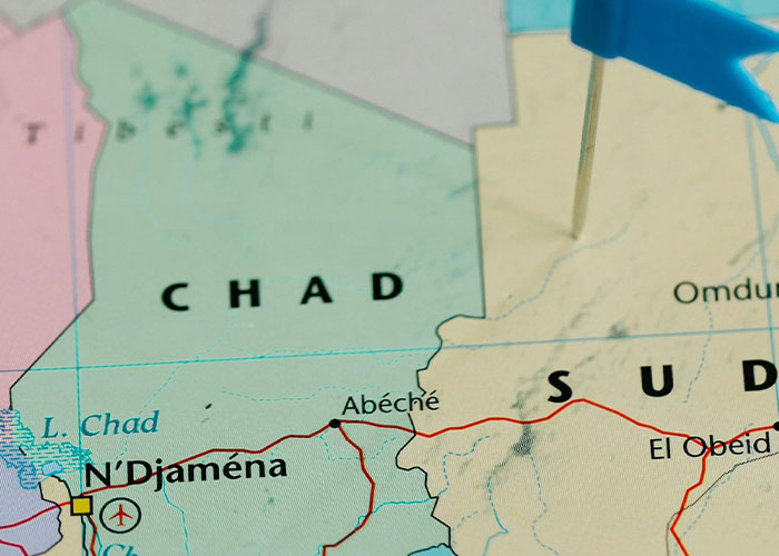 Map highlighting Chad and Sudan with a blue pin marking a location.