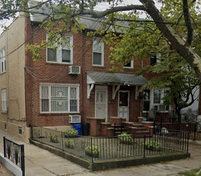 Brick house where young mom had illegal BBL implants removed by man posing as a plastic surgeon.