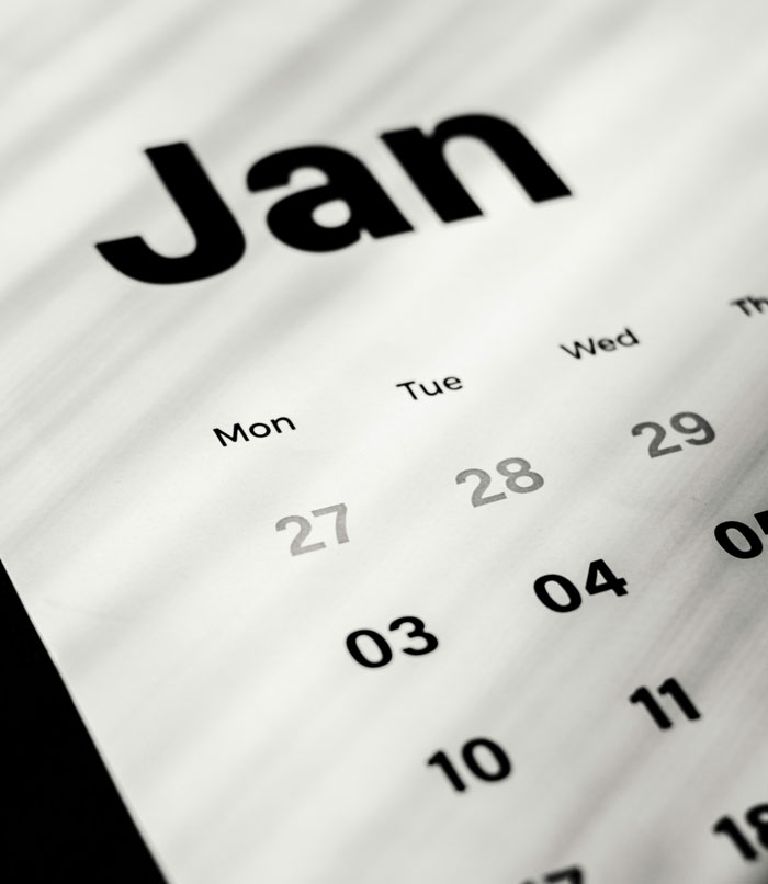 Close-up of a January calendar page, highlighting dates and days of the week, symbolizing planning SEO deliverables.