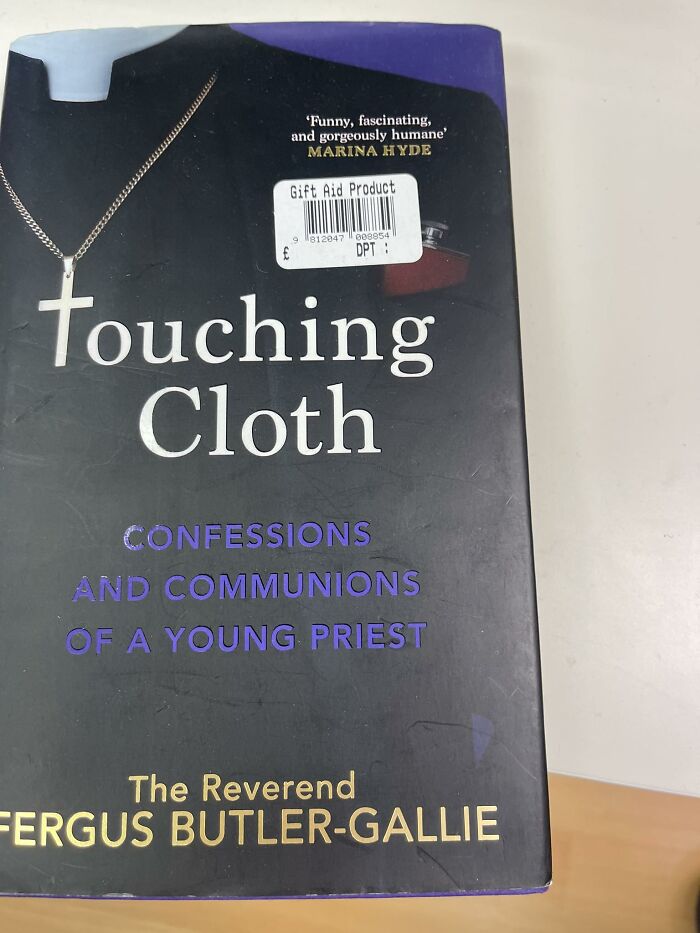 Bizarre treasure from a secondhand shop: "Touching Cloth" book with a priest theme on the cover.