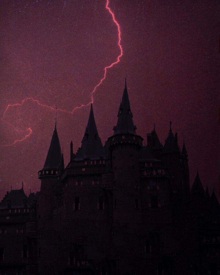 Dark escapism photography of a looming castle under a lightning-lit sky.