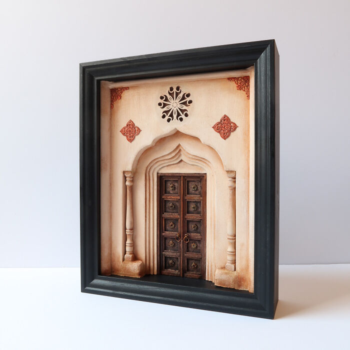 Miniature art by Tamar Cohen featuring an ornate, framed miniature doorway with intricate architectural details.