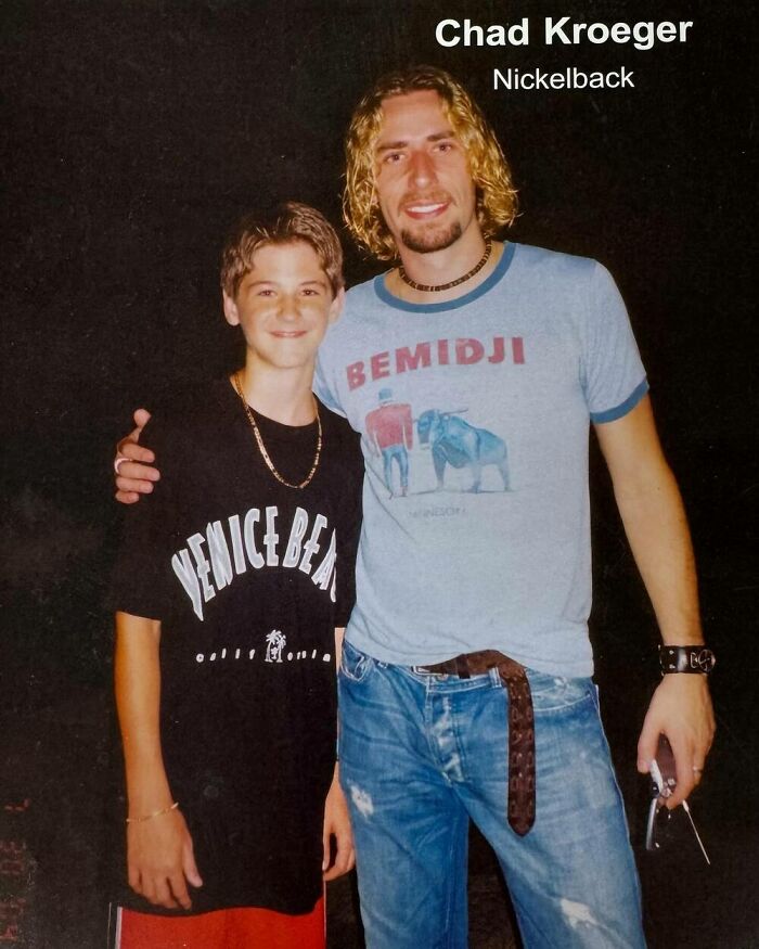Young fan posing with a celebrity in casual attire, featuring iconic musician.