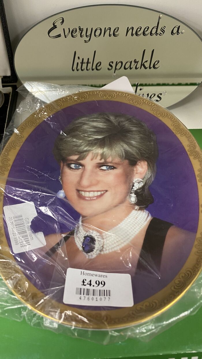 Bizarre treasure from a secondhand shop: decorative plate featuring a woman in jewelry for £4.99.