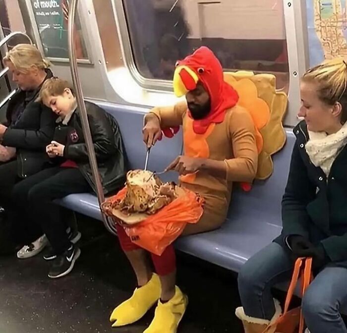 Man in a turkey costume carving meat on a subway, shared on random image Instagram account.