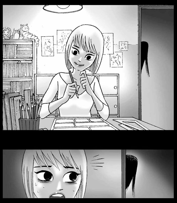 Young artist at desk in a suspenseful comic scene by DarkBox Comics, with mysterious hair visible through doorway.