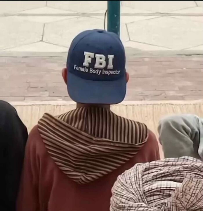 Person wearing a novelty "FBI: Female Body Inspector" cap in public setting, highlighting funny random images on Instagram.