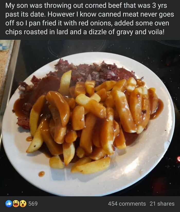 Plate of corned beef and fries with gravy, showcasing a dish served at a potluck.