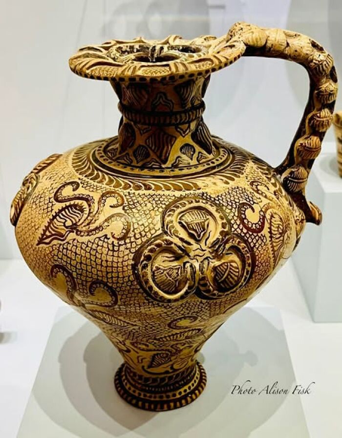 Ancient pottery with intricate designs and motifs showcased in archaeology news highlighting historical artifacts and architecture.