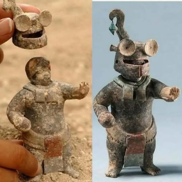 Ancient pottery figure with removable helmet, showcasing unique archaeology and architecture design from a historic culture.