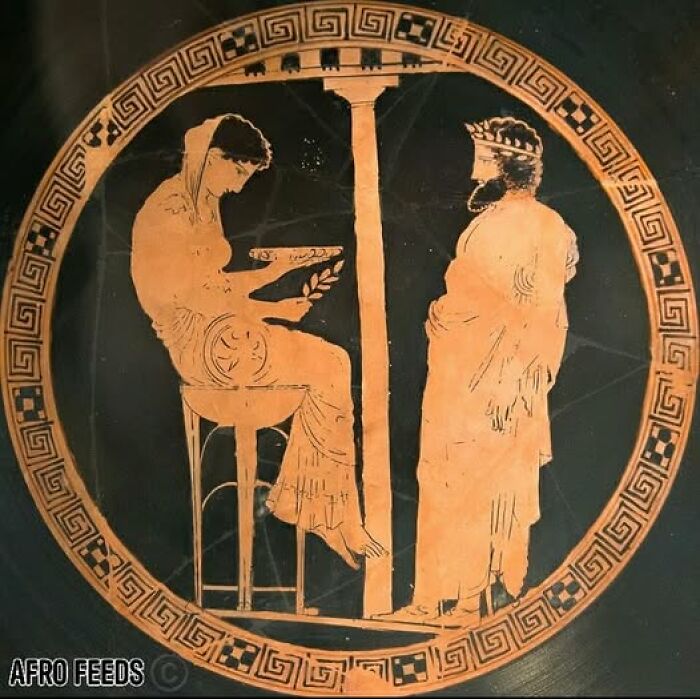 Ancient Greek pottery depicting two figures beside a pillar, showcasing archaeological art and architecture details.