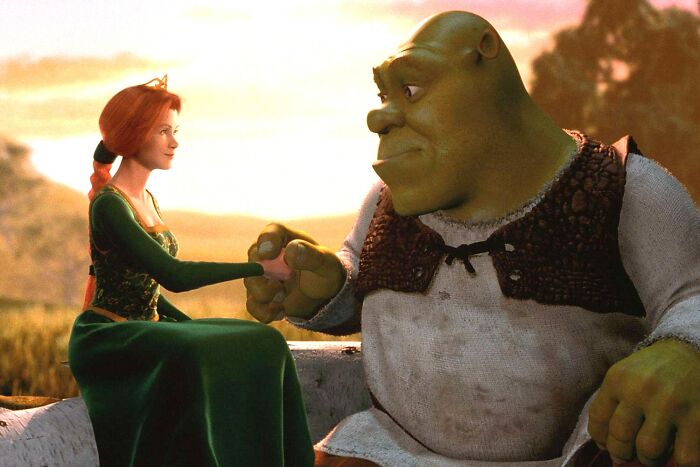 Woman and male beast from fairy tales highlighting beauty standards and gender roles in animated scene at sunset