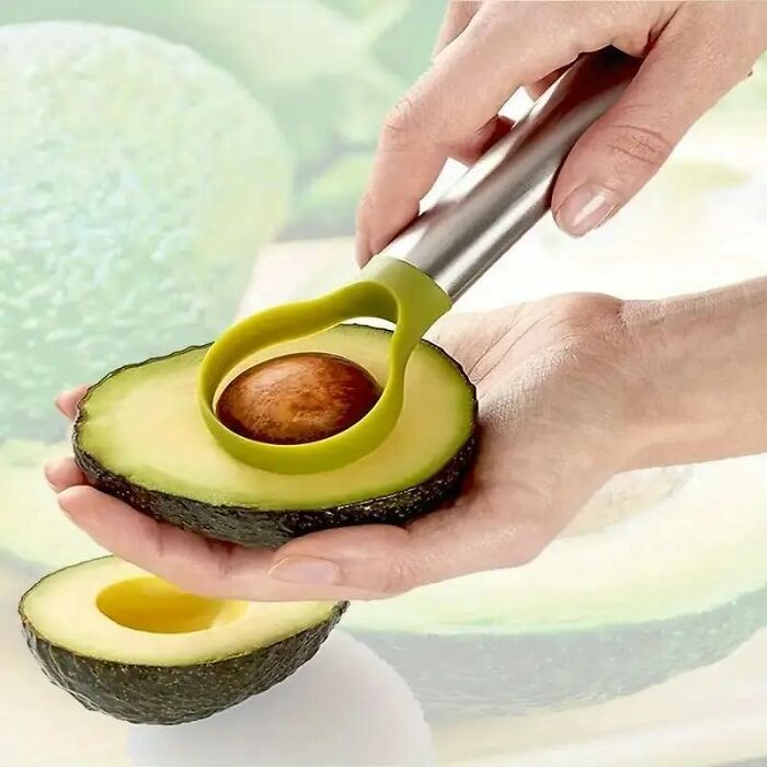 Hand using an avocado slicer tool from Amazon haul showcasing affordable kitchen deals that enhance cooking efficiency.
