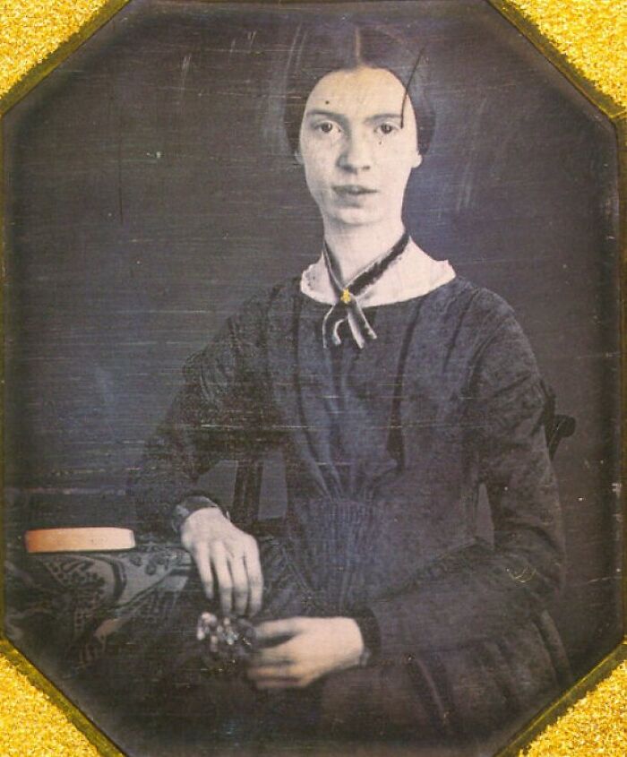 Rare photo of a famous historical figure in vintage attire seated with hands resting, showcasing 19th-century portrait style.