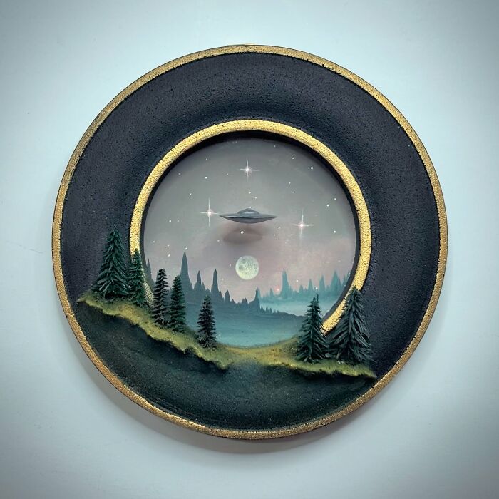 UFO hovering over a forest landscape diorama with moon and stars, ideal for alien and mystery lovers.