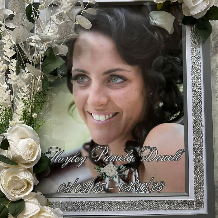 Memorial portrait surrounded by flowers, related to young mom's BBL surgery tragedy.