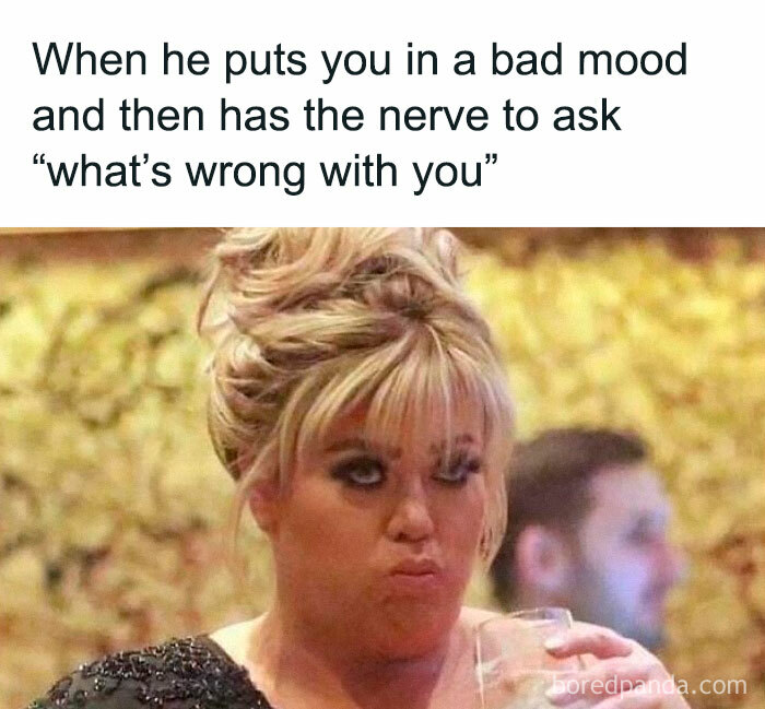 Woman with a skeptical expression holding a drink, showcasing a funny meme epitomizing random humor.