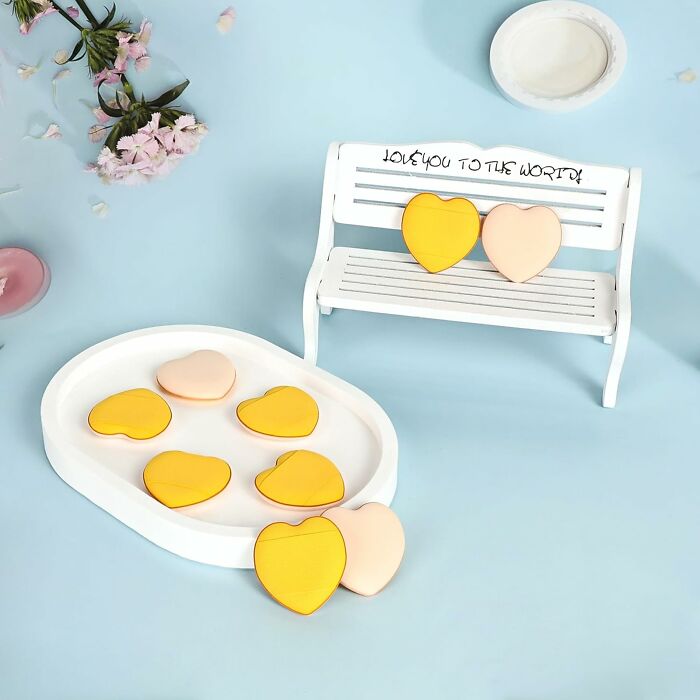 Heart-shaped cookies on bench, highlighting affordable Amazon haul finds in a pastel setting.