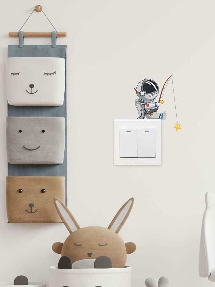 Cute wall organizer and astronaut sticker from low-cost shopping app.