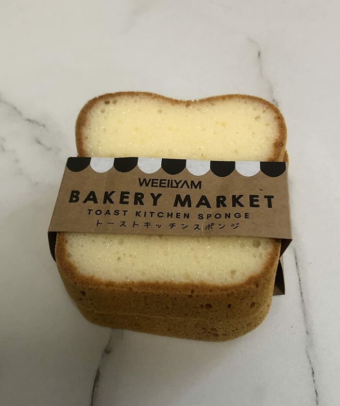 Food-shaped object resembling a slice of toast with bakery market label on a marble surface.