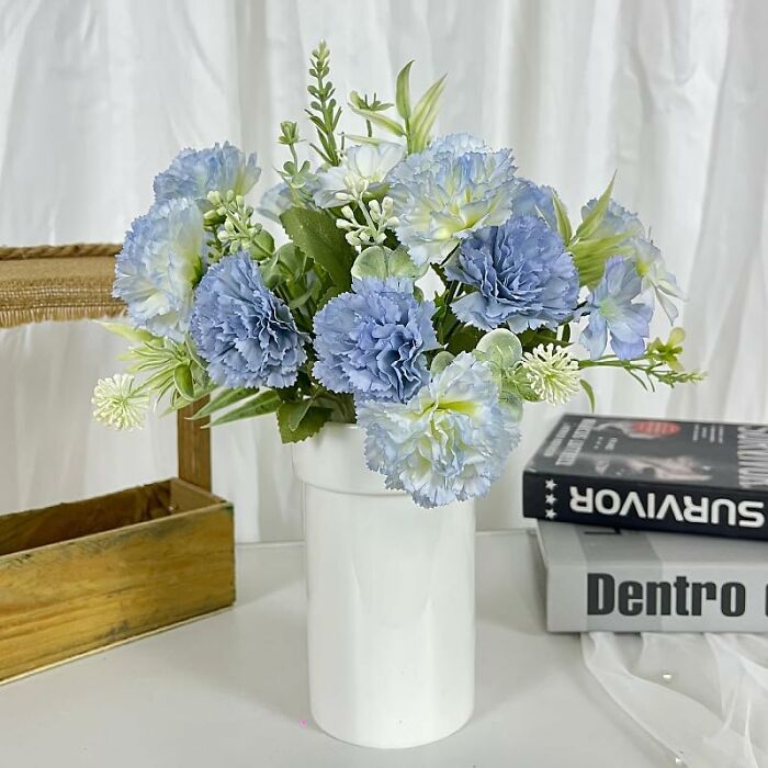 Blue and white floral arrangement in a vase, showcasing a stylish decor option from Amazon Haul against a neutral background.