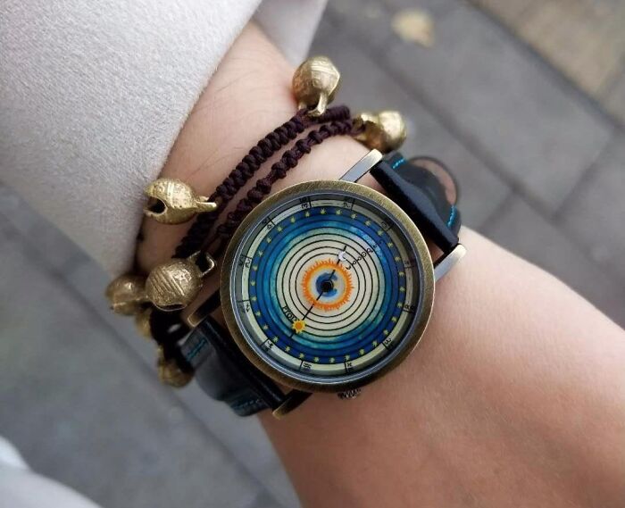 Unique Amazon finds wristwatch with colorful orbital design, blending genius innovation and quirky style on a wrist.