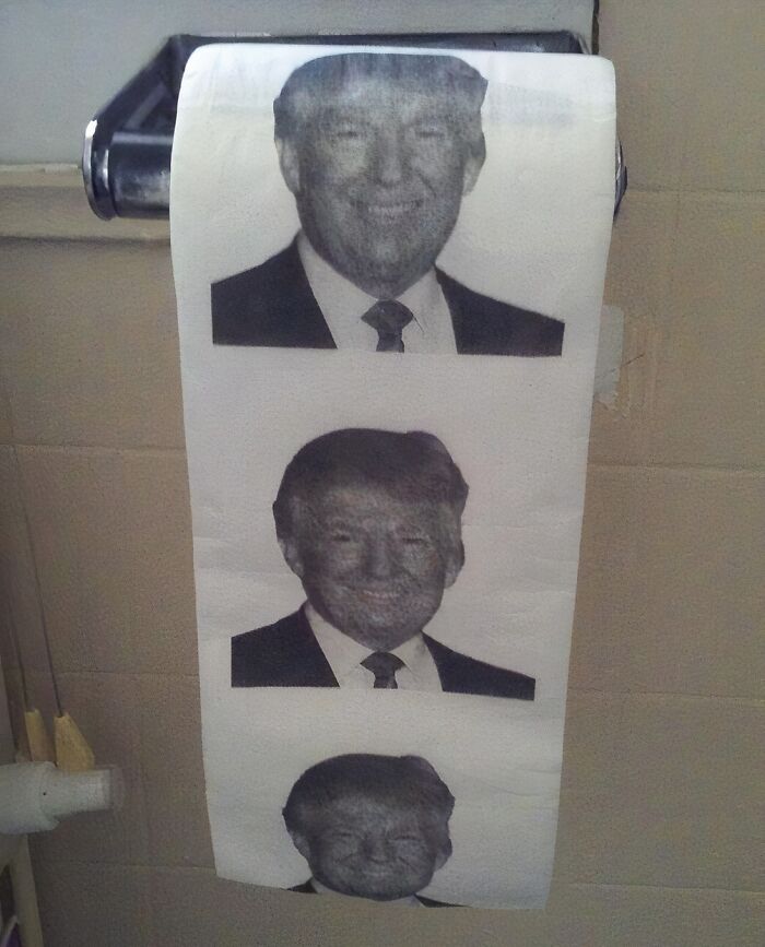 Toilet paper roll featuring a printed pattern of a man's face, one of the unique Amazon finds between genius and why does this exist.