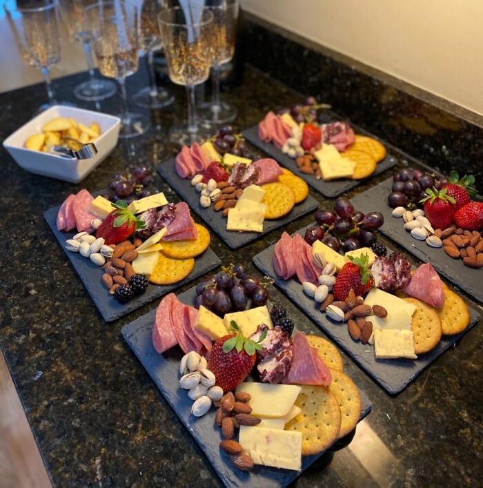 Charcuterie boards with cheese, crackers, strawberries, and nuts for a fresh start this spring.