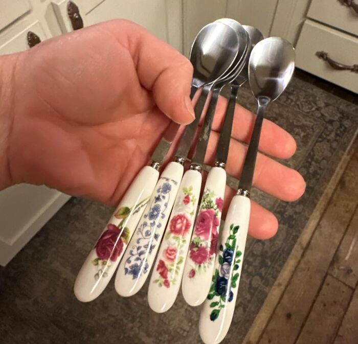 Hand holding spoons with floral-patterned handles, symbolizing fresh start and no-stress change this spring.