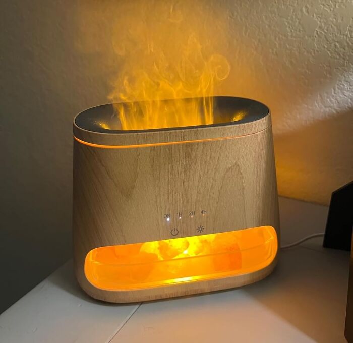 Wooden aromatherapy diffuser glowing with warm light, creating a relaxing ambiance for a fresh start this spring.