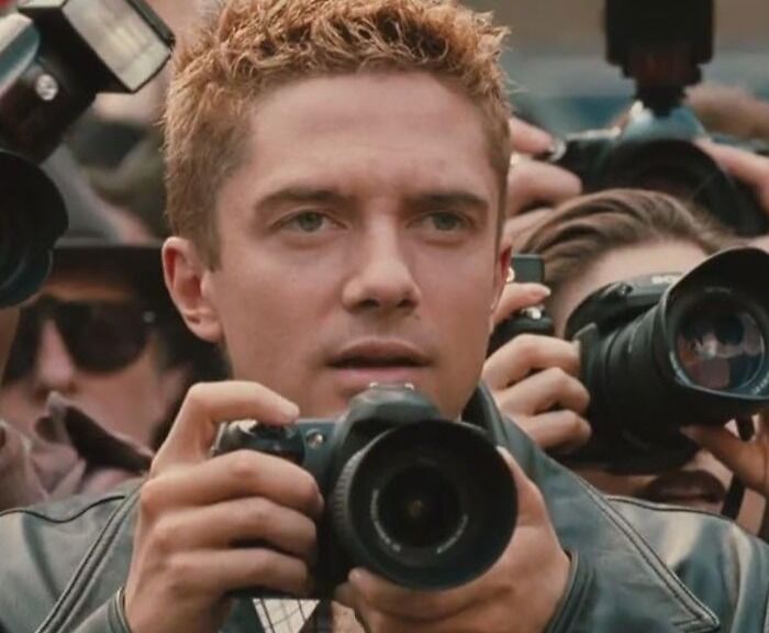 Photographer surrounded by cameras, highlighting a casting mistake Hollywood regrets.