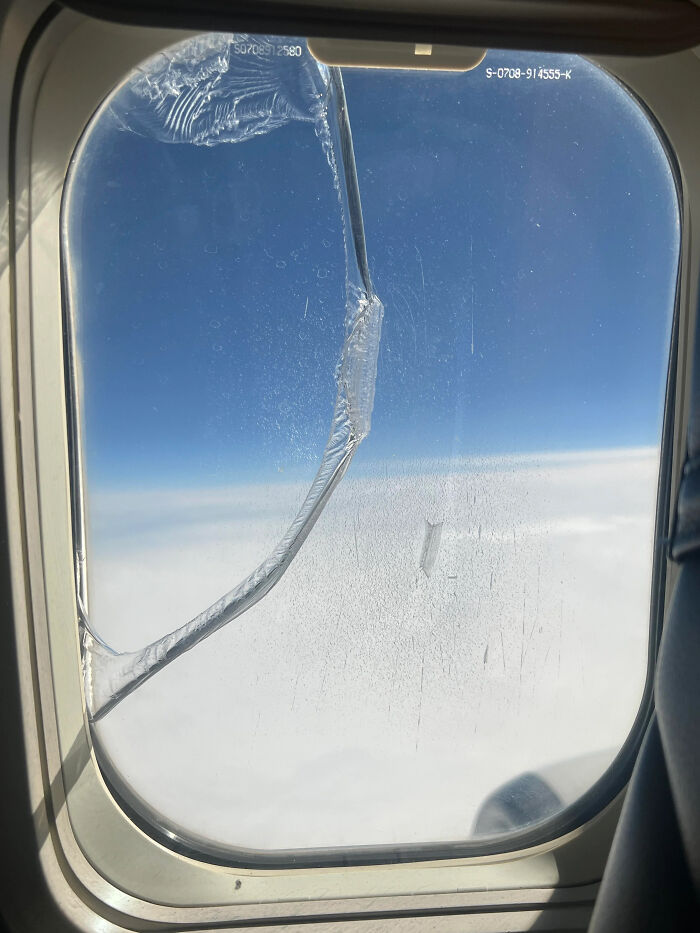 C*****d airplane window at high altitude, illustrating something dangerous.