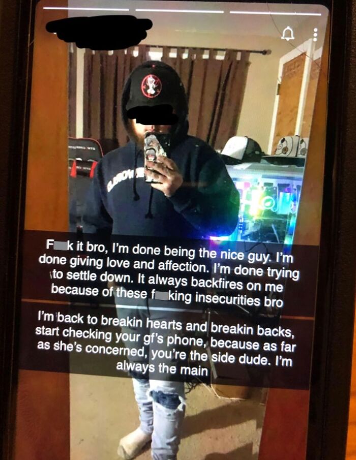 Individual in a mirror selfie wearing a hoodie with text overlay discussing relationships, showcasing cringe-worthy behavior.