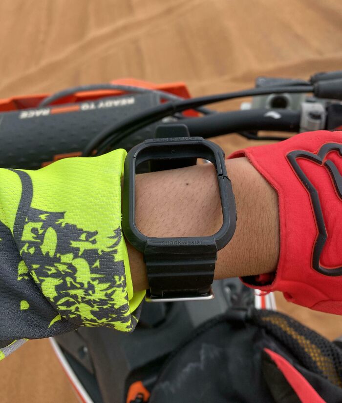 Motorcyclist with a broken watch strap on a ride, highlighting a horrible day moment.