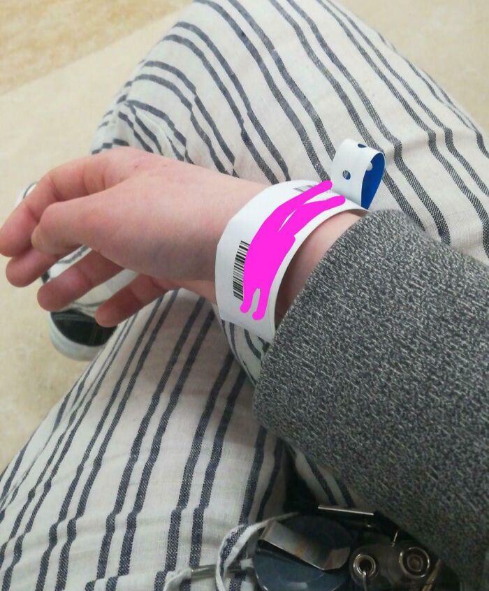 Person with hospital wristband, wearing striped pants, highlighting a challenging day scenario.