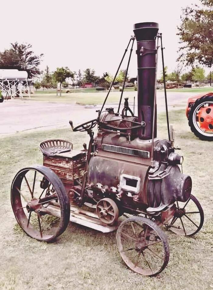 Vintage steam engine tractor displayed outdoors, capturing historical machinery appeal.