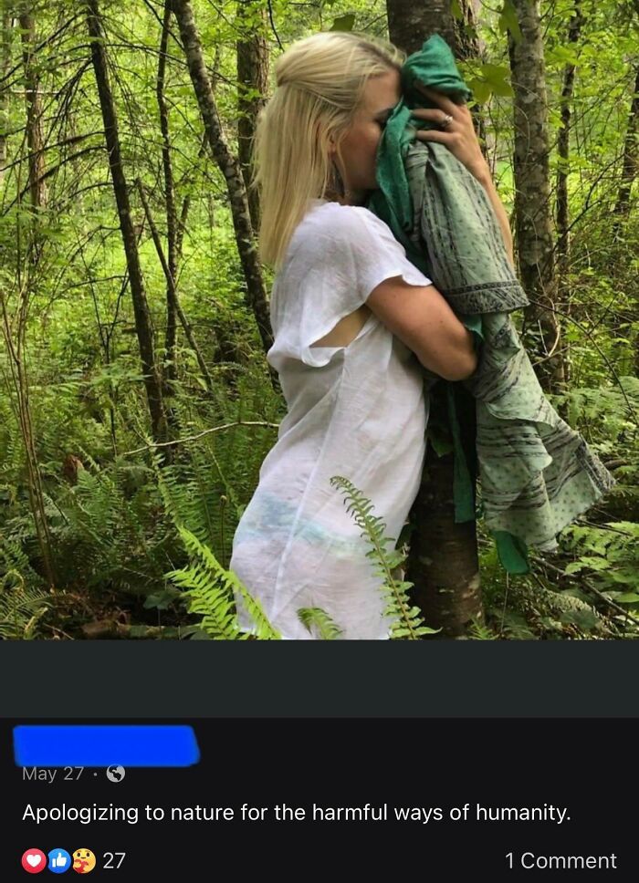 A person embracing a tree in the forest, expressing remorse for humanity's impact on nature, capturing a moment of cringe.