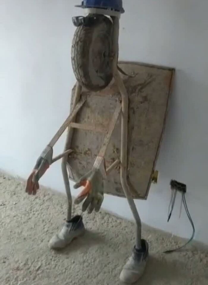 Homemade sculpture with a construction helmet and boots from popular IG page's best posts.