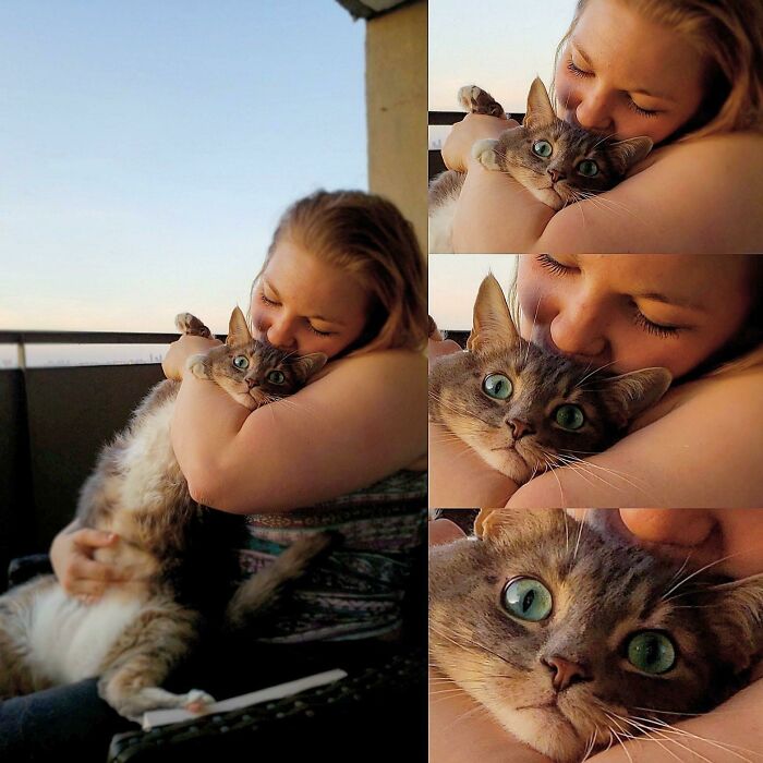 Woman hugging cat on a balcony, showcasing a loving bond with her feline friend. Cat's eyes wide open enjoying cuddles.