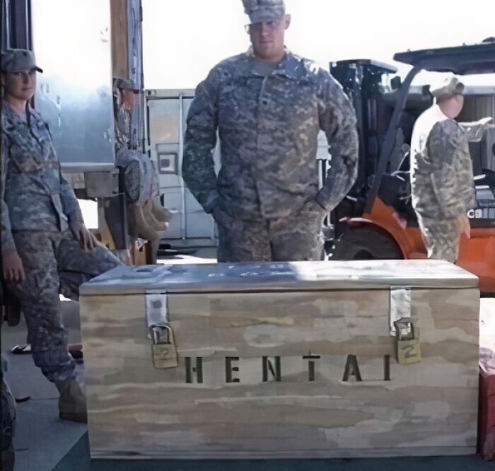 Soldiers stand around a wooden crate labeled with humorous text on an IG post.
