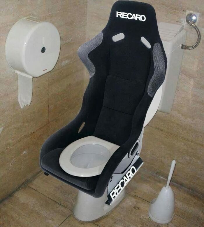 Recaro racing seat toilet in a bathroom, showcasing quirky design from a humorous IG page.