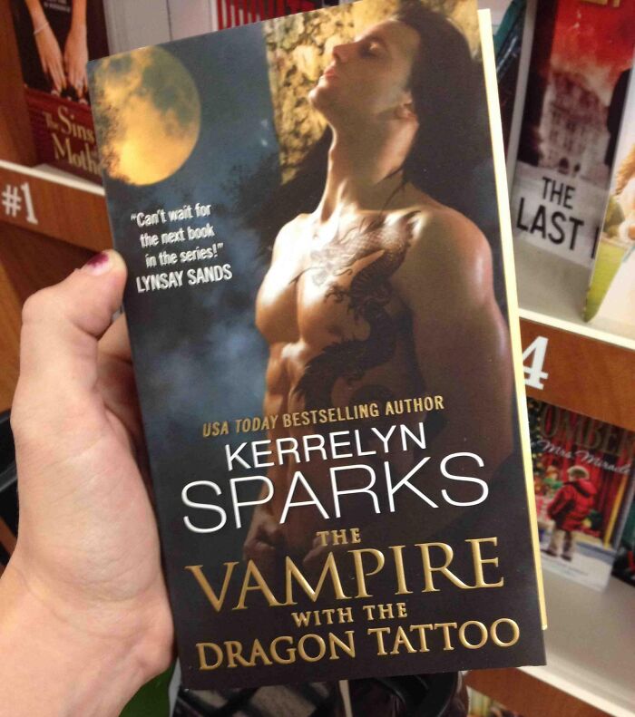 Book titled "The Vampire with the Dragon Tattoo" by Kerrelyn Sparks, depicting a shirtless man with a dragon tattoo.